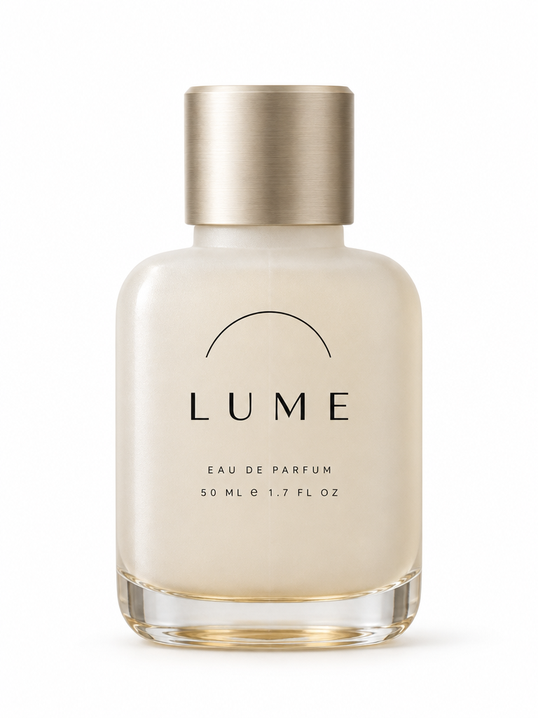 Studio product photograph of a fictional luxury fragrance bottle on a clean seamless white background, soft even daylight from the upper left, subtle contact shadow beneath.

The bottle: a squat rounded-rectangle flacon of thick frosted glass in a warm alabaster off-white, roughly 50ml, with softly chamfered vertical edges and a faint vertical mould seam. Heavy transparent glass base visible at the bottom with a slight liquid-amber tint. The cap is a solid brushed pale-champagne aluminium cylinder with a fine chamfer at its top edge, sitting flush on a short frosted neck.

Front face typography, screen-printed in matte black and perfectly legible: a thin engraved semicircular arc line across the upper third, and directly beneath it the wordmark "LUME" in a wide, high-contrast modern geometric sans with generous letterspacing. Below the wordmark, two smaller lines in tiny letterspaced capitals: "EAU DE PARFUM" and "50 ML e 1.7 FL OZ".

Editorial beauty-campaign lighting, crisp macro-lens realism, visible fine frosted-glass texture and gentle specular highlight down the left edge. Centered, full bottle in frame with generous margin. Photorealistic, ultra sharp, no props, no other objects, no text anywhere except on the bottle.

Render this exact on-image copy verbatim, with no spelling, wording, punctuation, or capitalization changes:
- LUME
- EAU DE PARFUM
- 50 ML e 1.7 FL OZ